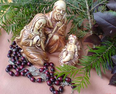 Maryja, Józef, Dzieciątko Jezus i różaniec